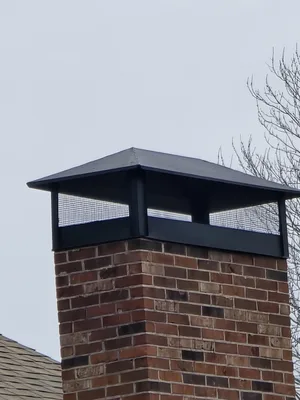 Full-span chimney cap installed on brick chimney