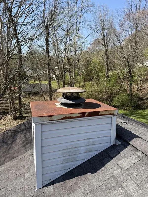 Rusted and deteriorated chase cover before replacement