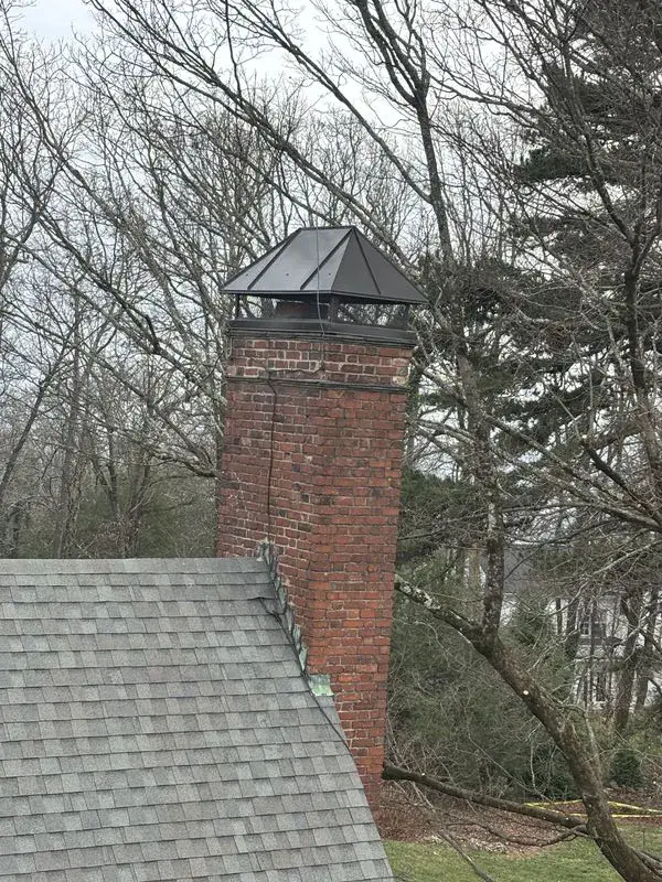 Completed custom chase cover installation on residential chimney