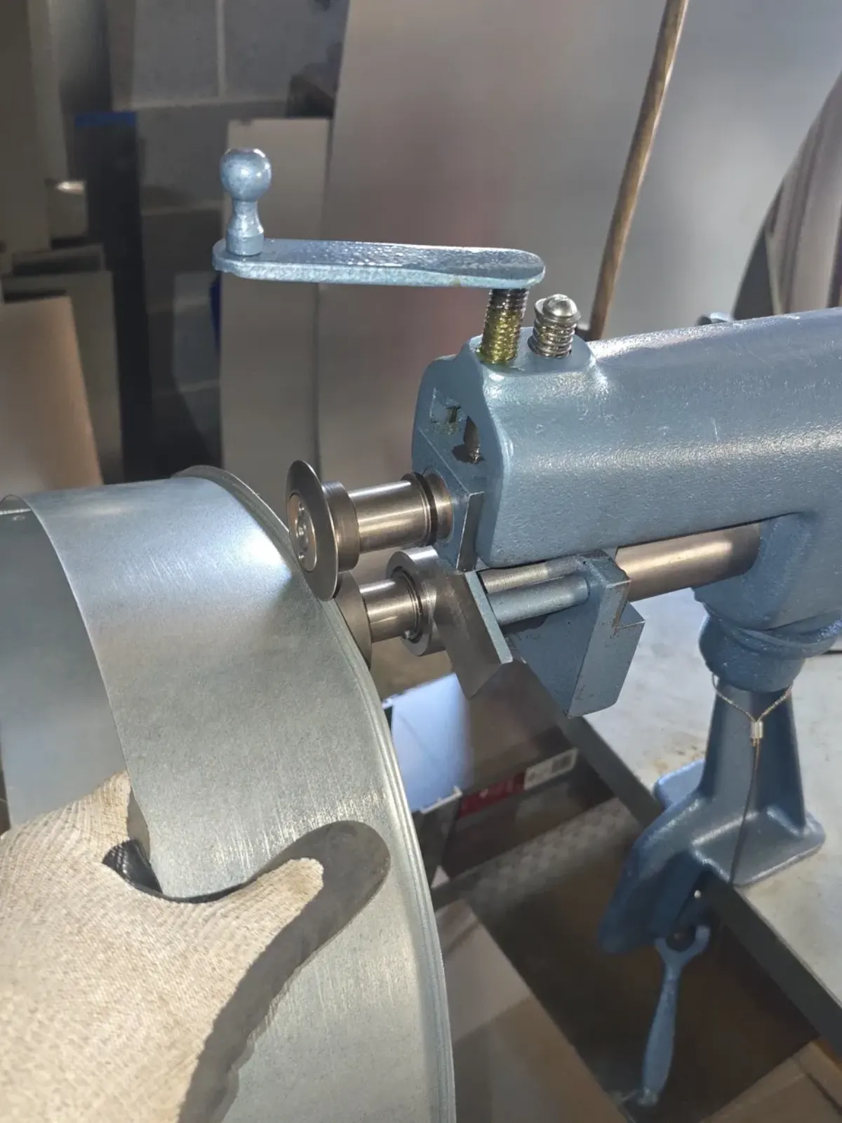 Bead roller shaping sheet metal for a custom chimney component